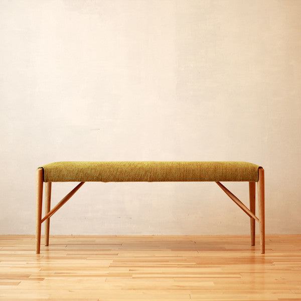 Banc rembourré en tissu et cuir