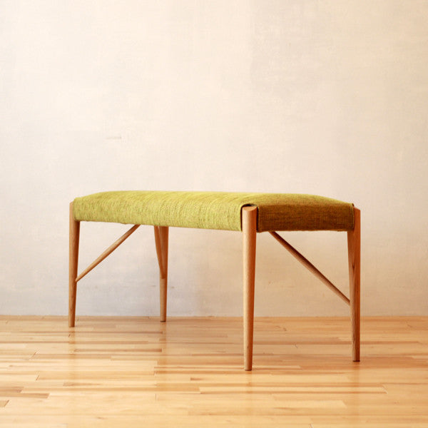 Banc rembourré en tissu et cuir